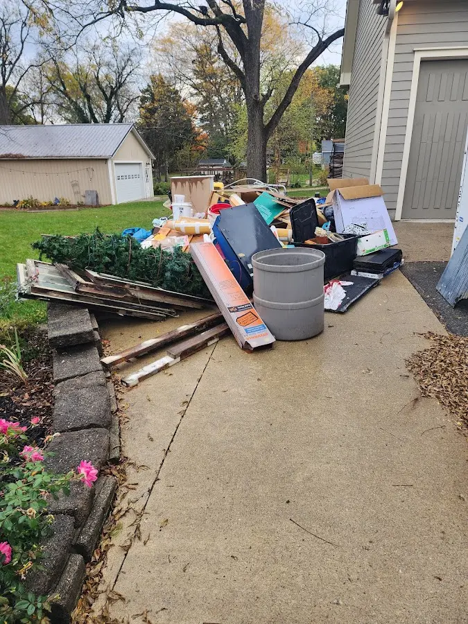 Dumpster being loaded with debris for 3 Yard Dumpster Rental in Lower Pottsgrove